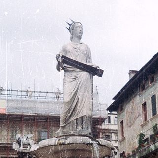 Statue fountain in historic European square.