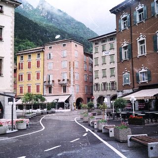 Charming alpine town square with colorful buildings.