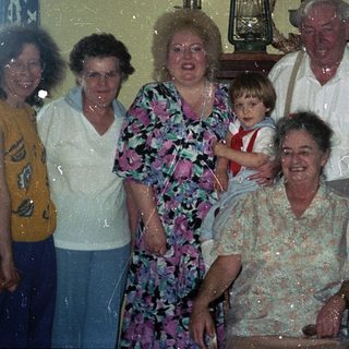 Family group portrait from the 1980s or 1990s.