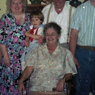 Family group portrait from the 1980s or 1990s.