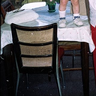 Grandmother and young child in cozy kitchen.