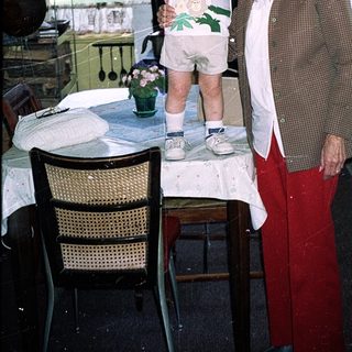 Grandmother and young child in cozy kitchen.