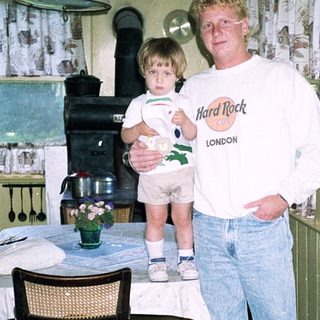 Man holding child in vintage London hotel room.