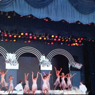Traditional dance performance on stage.