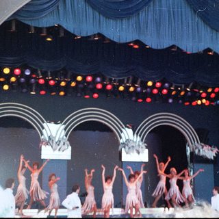 Traditional dance performance on stage.