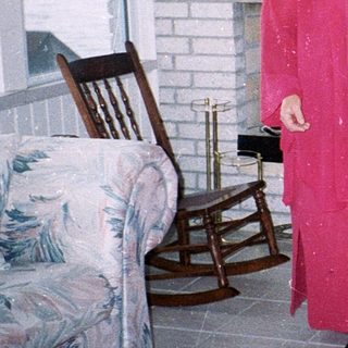 Two women and two dogs indoors.