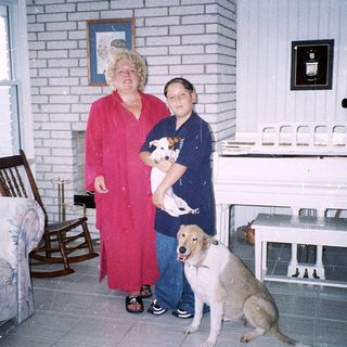 Two women and two dogs indoors.