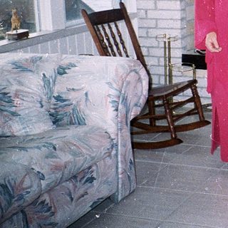 Two women and two dogs indoors.