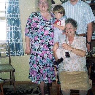 Family portrait in a vintage kitchen setting.