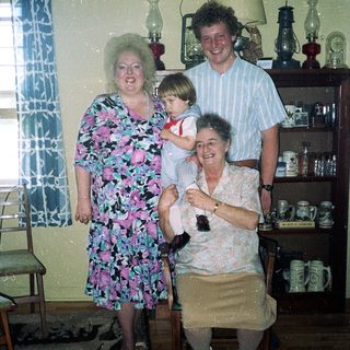 Family portrait in a vintage kitchen setting.