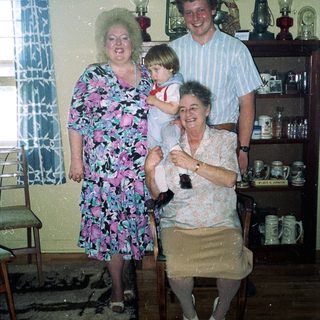 Family portrait in a vintage kitchen setting.
