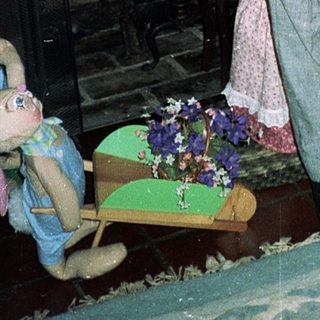 Two children posing indoors in 1980s-style clothing.