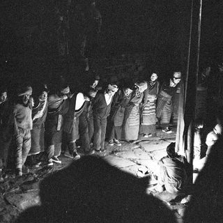Traditional nighttime folk gathering with communal singing.