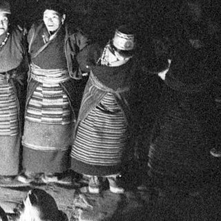 Traditional folk choir performing indoors.