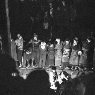 Traditional folk gathering around a fire.