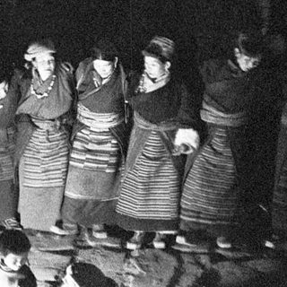 Traditional folk gathering around a fire.