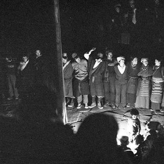 Group singing traditional folk songs indoors.