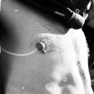 Body piercing on upper chest area.
