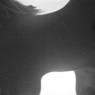 Silhouette of person facing bright light.