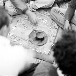 Men playing traditional board game together.
