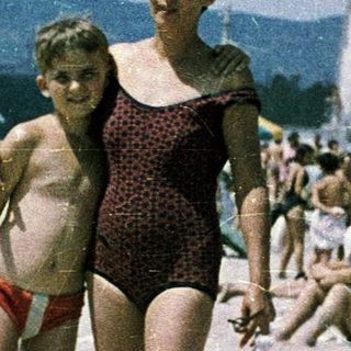 Family beach scene from mid-20th century.