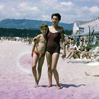 Family beach scene from mid-20th century.