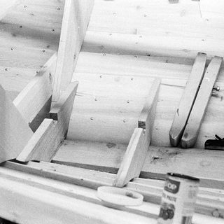 Wooden frame assembly with angled supports.