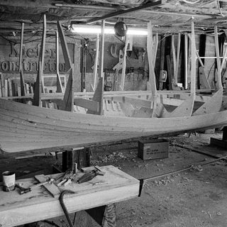 Boat under construction in workshop.