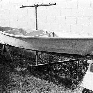 Vintage wooden boat on dry land.