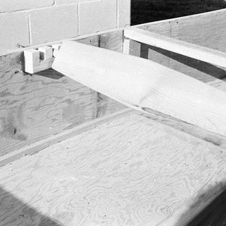 Concrete slab with wooden formwork in place.