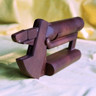 Miniature wooden horse harness or bridle piece.