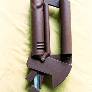 Multi-tool with hammer and bottle opener.