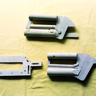 3D-printed plastic mechanical bracket components.