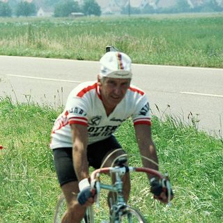 Two cyclists racing on a road.