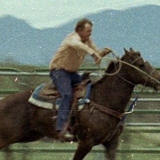 Cowboy rodeo event: rider chasing calf.
