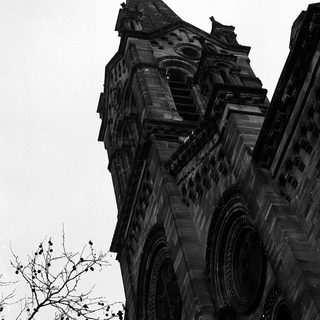 Gothic-style church tower with intricate stonework.