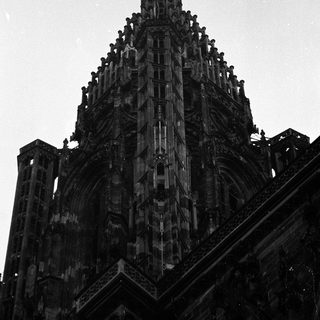 Gothic cathedral spire with intricate stone detailing.