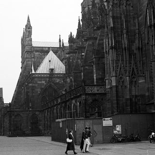 Gothic cathedral facade with intricate stonework and minimal crowd.