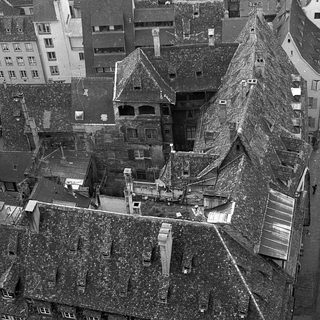 Aerial view of historic European town rooftops.