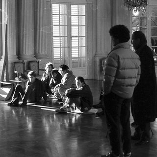 Group rehearsing in a grand indoor setting.