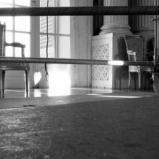 Vintage gymnasium with balance beam and vintage furniture.