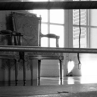 Vintage gymnasium with balance beam and vintage furniture.