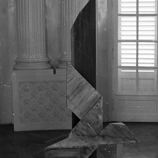 Abstract geometric sculpture in classical interior.