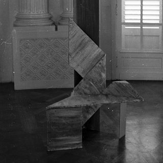 Abstract geometric sculpture in classical interior.