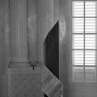 Abstract geometric sculpture in classical interior.