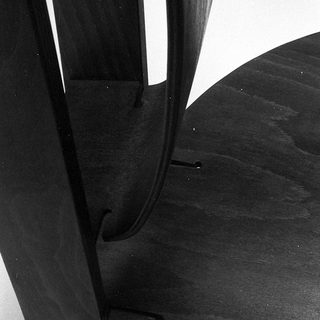 Modern curved wooden chair legs.