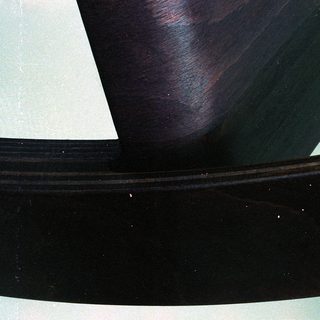 Curved black interior ceiling panel.