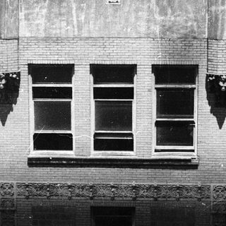 Vintage urban building under renovation or demolition.