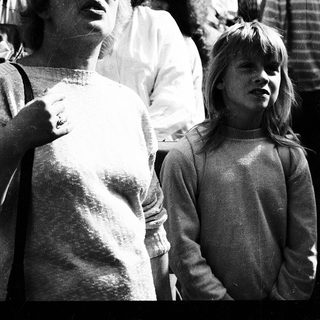 Two people, likely mother and daughter, at an outdoor event.