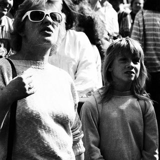 Two people, likely mother and daughter, at an outdoor event.
